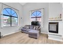 Comfortable living room features large windows, fireplace, and neutral decor at 500 N Roosevelt Ave # 53, Chandler, AZ 85226