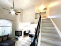Charming living space with fireplace, staircase, fan and comfortable seating at 500 N Roosevelt Ave # 53, Chandler, AZ 85226