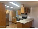 Functional kitchen featuring stainless steel appliances and sleek countertops for modern meal preparation at 5933 E Main St # 1, Mesa, AZ 85206