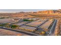 An aerial view shows the scale of this Primary planned desert community with mountain views at 6848 N 190Th Ave, Waddell, AZ 85355