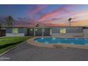 Inviting backyard featuring a pristine private pool, perfect for relaxation and entertaining under a colorful sky at 727 N Beverly --, Mesa, AZ 85201