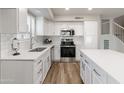 Bright kitchen featuring stainless steel appliances, ample cabinetry, and elegant countertops at 1073 N 159Th Dr, Goodyear, AZ 85338