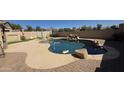 Beautiful pool featuring stone accents and a textured concrete patio for outdoor enjoyment at 1075 E Crimm Rd, San Tan Valley, AZ 85143