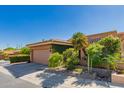 Charming single-story home featuring desert landscaping, tile roof, and a two car garage at 10830 N 11Th St, Phoenix, AZ 85020