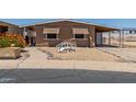 Cozy single story home with awnings and a covered carport is move-in ready at 11275 N 99Th Ave # 1, Peoria, AZ 85345