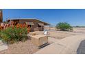 Cozy single story home with awnings and a covered carport is move-in ready at 11275 N 99Th Ave # 1, Peoria, AZ 85345