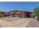 Cozy single story home with awnings and a covered carport is move-in ready at 11275 N 99Th Ave # 1, Peoria, AZ 85345