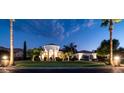 An exterior view of the property showcases professional landscaping and elegant architecture at 11307 E Elmhurst Dr, Chandler, AZ 85249