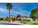 An exterior view of the property during the day showcases the meticulously maintained landscaping at 11307 E Elmhurst Dr, Chandler, AZ 85249