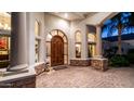 Grand entrance featuring custom wood door, decorative glass, and stone accents at 11307 E Elmhurst Dr, Chandler, AZ 85249