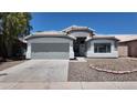A well-maintained single-story home with a spacious driveway and manicured landscaping at 11342 W Barbara Ave, Peoria, AZ 85345