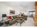 Spacious living room with plush seating, a ceiling fan, and an open floor plan for easy entertaining at 12222 N Paradise Village S Pkwy # 220, Phoenix, AZ 85032