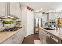 Well-equipped kitchen features sleek cabinetry, modern appliances, and stylish countertops for easy meal preparation at 13088 N 91St Dr, Peoria, AZ 85381