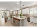 Spacious kitchen island with seating, stainless steel appliances, and open layout at 1713 E Bridgeport Pkwy, Gilbert, AZ 85295