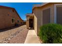 Front entrance to this single story home with desert landscaping at 1719 E Sandalwood Rd, Casa Grande, AZ 85122