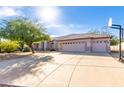 Lovely house with a spacious driveway, three-car garage, and a basketball hoop on the side at 21 E Irvine Rd, Phoenix, AZ 85086