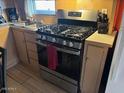 Close up view of stainless steel stove, sink and cabinetry at 300 S Val Vista Dr # 77, Mesa, AZ 85204