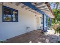 Covered patio with tiled floor, offering outdoor living space and shade at 3303 E Clarendon Ave, Phoenix, AZ 85018