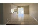 Open dining area with sliding glass doors leading to the backyard and a breakfast bar at 3827 E Sweetwater Ave, Phoenix, AZ 85032