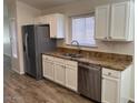 Kitchen with stainless steel appliances, ample cabinet space, and granite countertops at 4632 E Melinda Ln, Phoenix, AZ 85050