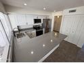 Kitchen features new stainless steel appliances and a spacious breakfast bar countertop at 4849 W Northern Ave, Glendale, AZ 85301