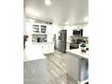 Well-appointed kitchen with stainless steel appliances, bright countertops, and ample storage at 501 E Ray Rd # 230, Chandler, AZ 85225