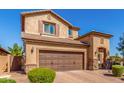 Charming two-story home with a two-car garage and stone accents on the facade at 5235 S Dante --, Mesa, AZ 85212