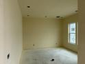 Bright bedroom with a large window and neutral walls at 6446 E Omega Cir, Mesa, AZ 85215