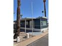 Charming single story home featuring desert landscaping and a covered porch and entrance at 7807 E Main St # H-20, Mesa, AZ 85207