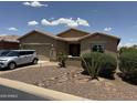 Charming single-story home featuring desert landscaping, a two-car garage, and neutral paint scheme at 20119 N Laguna Way, Maricopa, AZ 85138