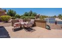 Cozy patio area with outdoor seating, offering a relaxing space with charming views at 20119 N Laguna Way, Maricopa, AZ 85138