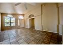 Spacious open-plan living area with neutral walls and tile floors providing a blank canvas at 20443 N 39Th Dr, Glendale, AZ 85308
