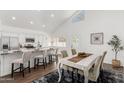 Eat-in kitchen featuring a dining table and bar seating at 2137 E New Bedford Dr, Gilbert, AZ 85234