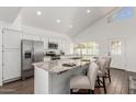Modern kitchen boasting granite countertops, stainless steel appliances, and a breakfast bar at 2137 E New Bedford Dr, Gilbert, AZ 85234
