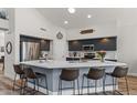 Spacious kitchen features a large island with seating, stainless steel appliances, and modern finishes at 3123 E Buena Vista Dr, Chandler, AZ 85249