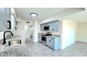 Charming kitchen featuring stainless steel appliances, granite countertops, and modern cabinetry offering functionality and style at 3708 W Peoria Ave, Phoenix, AZ 85029