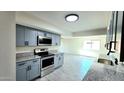 Beautiful updated kitchen with granite countertops and modern stainless steel appliances providing a modern touch at 3708 W Peoria Ave, Phoenix, AZ 85029