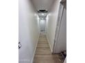 Long hallway featuring new flooring, ready for final touches and customization at 3725 E Karen Dr, Phoenix, AZ 85032
