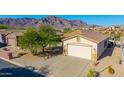 Charming single-story home with a well-maintained front yard and attached garage at 4297 S Pony Rider Trl, Gold Canyon, AZ 85118