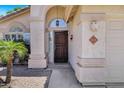 Charming front door with portico, columns, and desert landscaping at 625 W Douglas Ave, Gilbert, AZ 85233