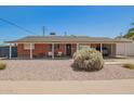 Charming brick home featuring a covered carport and a low-maintenance desert landscape at 8155 E Columbus Ave, Scottsdale, AZ 85251