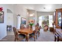 Bright dining room featuring a wooden table, decorative chairs, and charming decor at 9038 E Calle De Valle Dr, Scottsdale, AZ 85255