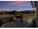 Stunning desert residence featuring an outdoor fireplace on the patio, perfect for relaxing and entertaining at 12746 E Casitas Del Rio E Dr, Scottsdale, AZ 85255