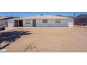 Modest single-story home with a white exterior and desert landscaping, providing a neat and tidy appearance at 1526 W North Ln, Phoenix, AZ 85021