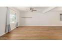 Bright living room with wood floors, recessed lighting, and white walls at 1959 E Orion St, Tempe, AZ 85283