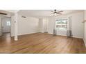 Inviting living room with modern ceiling fan, wood floors and closet at 1959 E Orion St, Tempe, AZ 85283