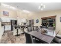 Open-concept living space features a modern kitchen, dining area, and sleek finishes at 2108 E Patrick Ln, Phoenix, AZ 85024
