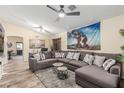 Comfortable living room with a sectional sofa, ceiling fan, and neutral color palette at 2108 E Patrick Ln, Phoenix, AZ 85024