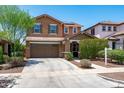 Inviting two-story home featuring a two-car garage and well-maintained landscaping at 2120 N Heritage St, Buckeye, AZ 85396