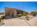 Single-story home with covered carport and low-maintenance desert landscaping at 2529 N Barber Dr, Mesa, AZ 85215